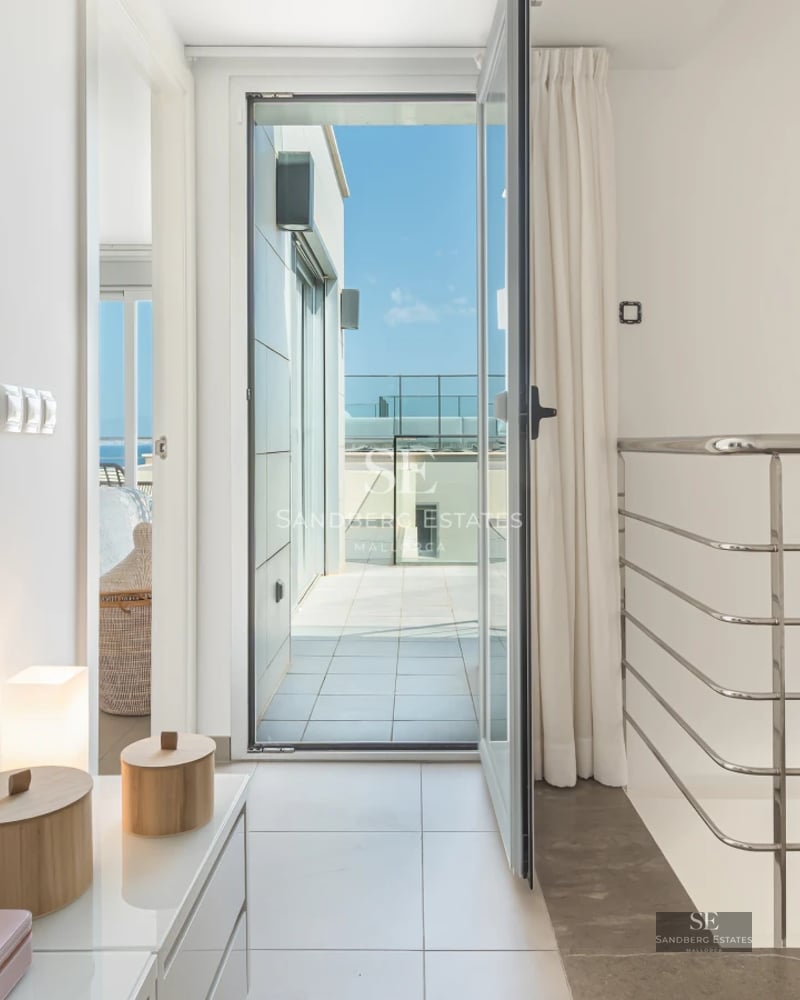 Exterior view of a modern villa with pool, garden, and minimalist architecture. Large windows and natural light.