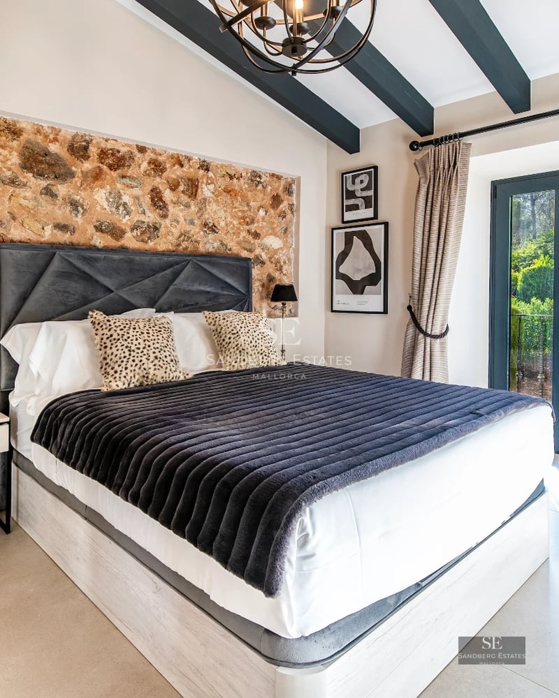 Spacious living room with panoramic windows, light wood floors, modern designer furniture and stunning sea views.