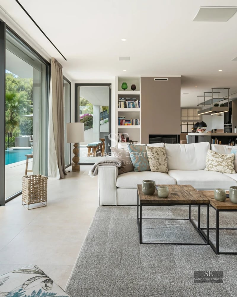 Luxurious exterior view with reflecting pool, modern architecture, and expansive green space. Sophisticated design, ambient lighting.