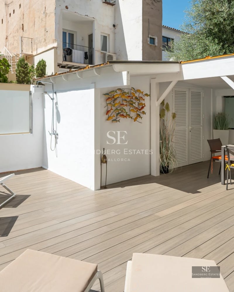 Exterior view of a modern villa with a pool, garden, and large windows offering abundant natural light. Contemporary architectural design.