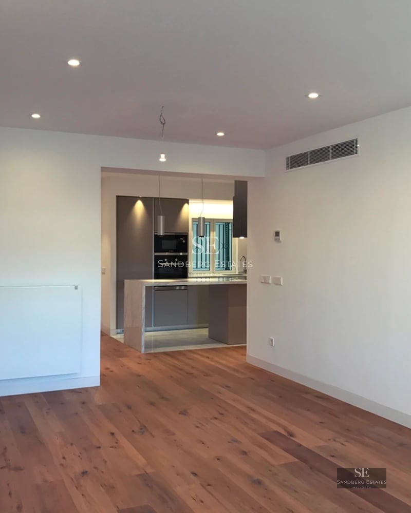 Exterior view of a modern villa with a swimming pool, surrounded by greenery. Minimalist architecture with large windows.