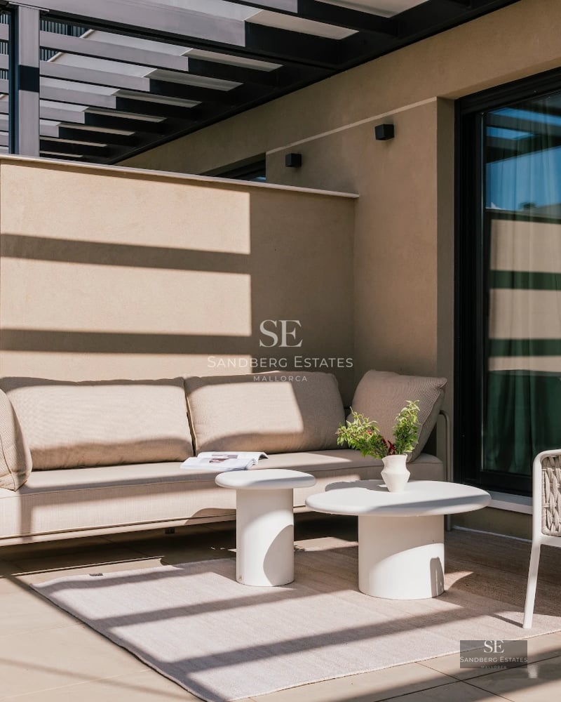 Spacious terrace with infinity pool, sun loungers, and panoramic views. Modern design with ambient lighting and lush vegetation.