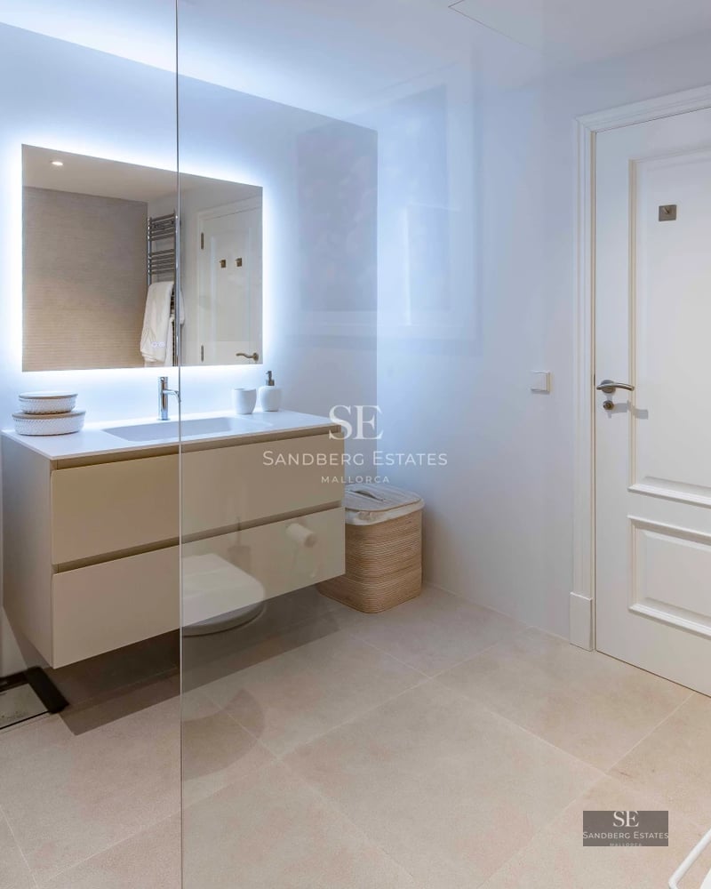 Exterior view of a modern villa with infinity pool, lush garden, and expansive terraces. Minimalist architecture with large windows.