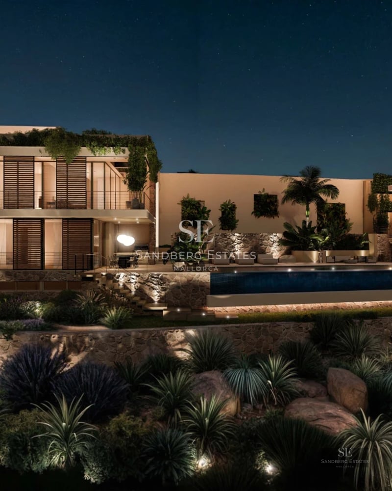 Wide view of a modern villa featuring an infinity pool and sea view. Minimalist design, large windows and sunny terrace.
