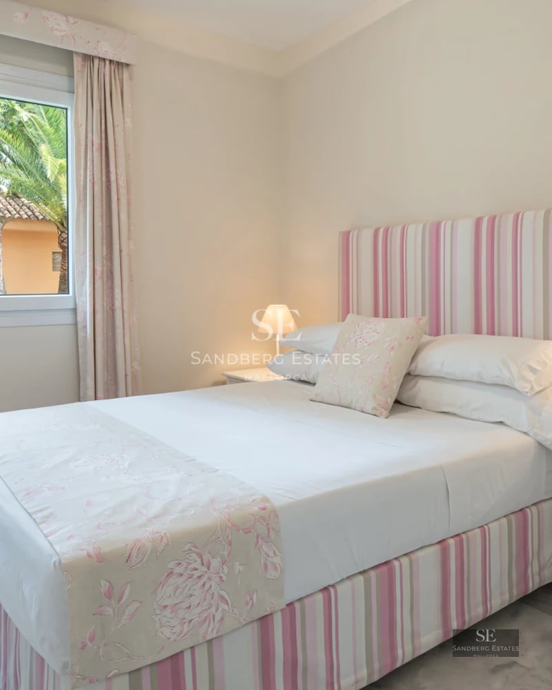 Panoramic view of a modern apartment with balcony and sea views. Minimalist design, luxury finishes.