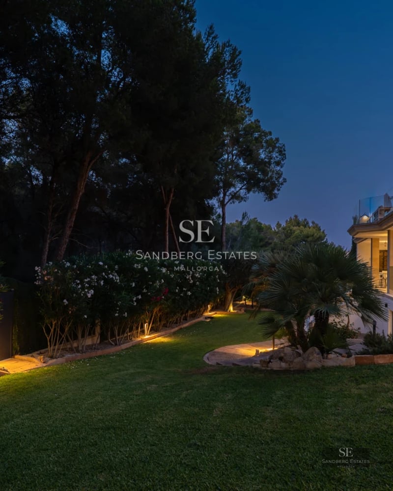 Spacious terrace with infinity pool. Panoramic views. Modern designer furniture. Warm ambient lighting.