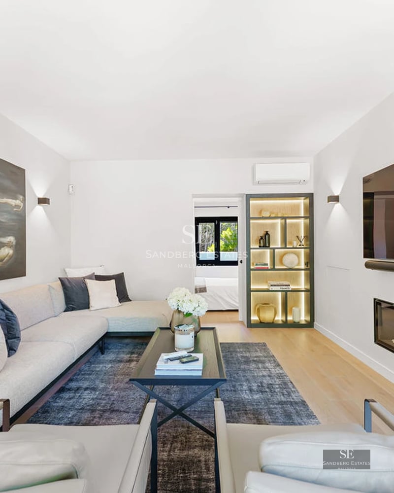 Expansive terrace featuring an infinity pool with ocean views. Lush garden with sun loungers and seating area. Modern and elegant design.