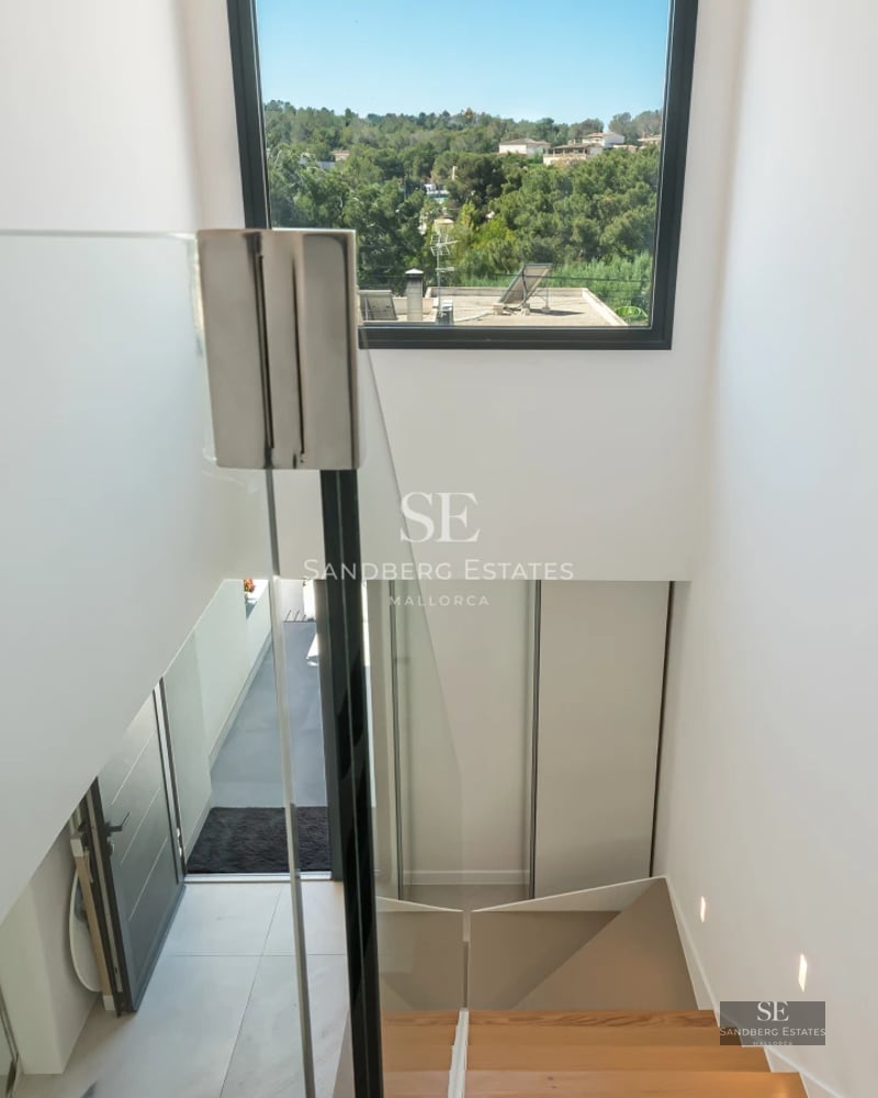 Exterior view of modern villa with infinity pool, lush garden, and spacious terraces. Minimalist architectural design with high-quality finishes.