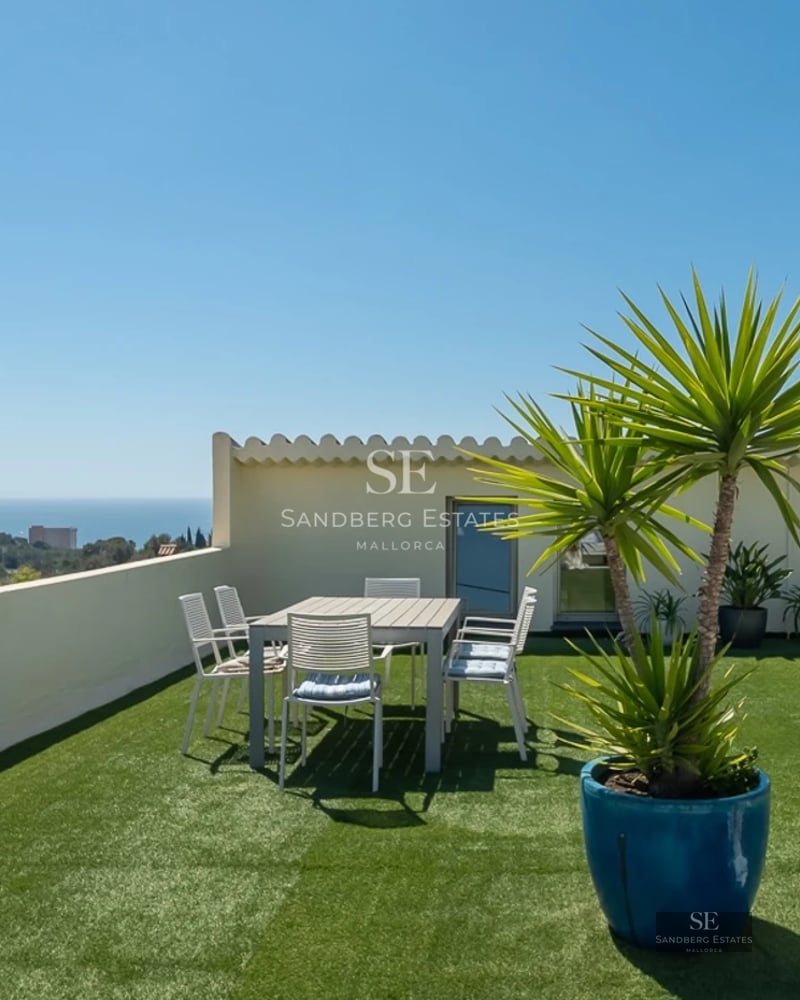 View of luxury modern villa with infinity pool, garden, and large windows. Minimalist design with neutral tones and abundant natural light.