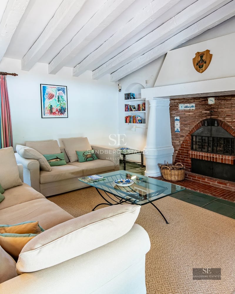 Spacious balcony with panoramic sea views. Modern design, glass railing and outdoor furniture. Luxury and comfort by the ocean.