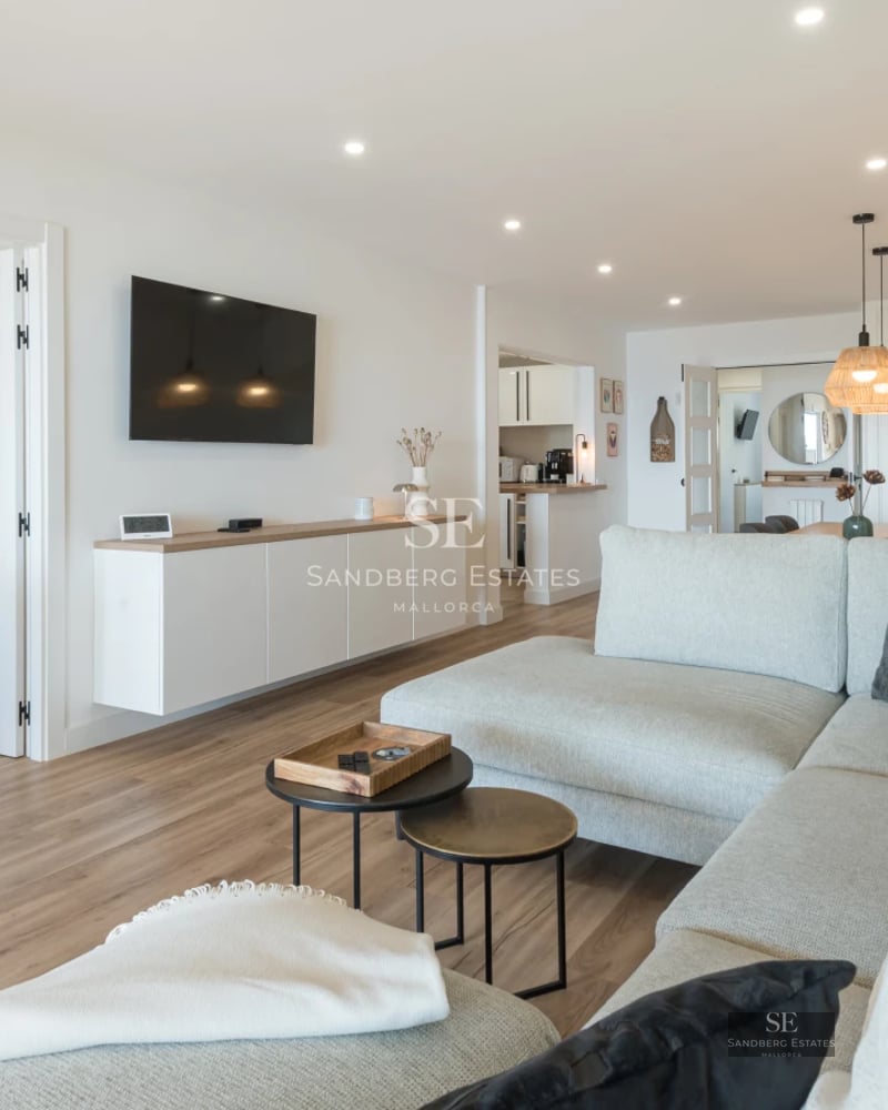 Expansive terrace with pool, sun loungers, and panoramic views. Modern design with ambient lighting.