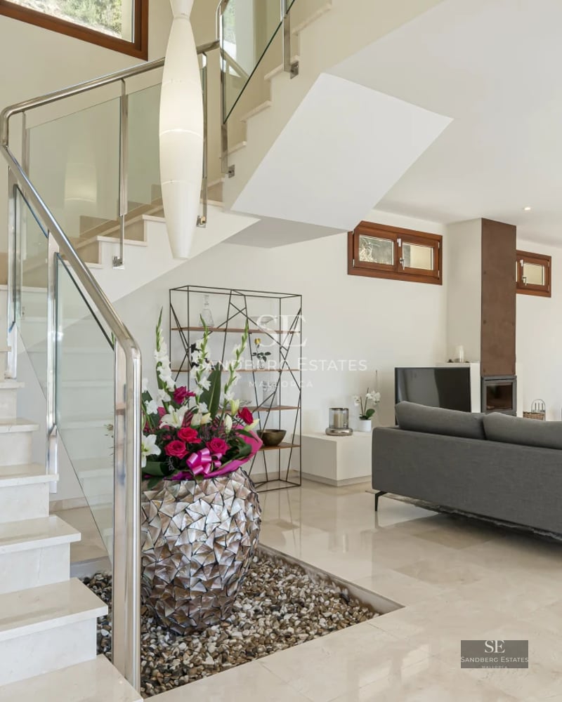 Spacious terrace with infinity pool, sun loungers, and panoramic sea views. Modern design with high-quality materials.