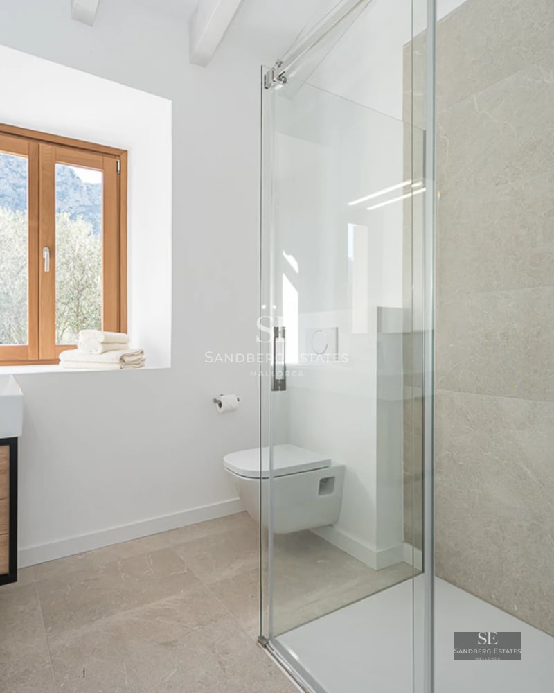 Spacious living room with large windows offering stunning sea views. Modern design with luxury furnishings.