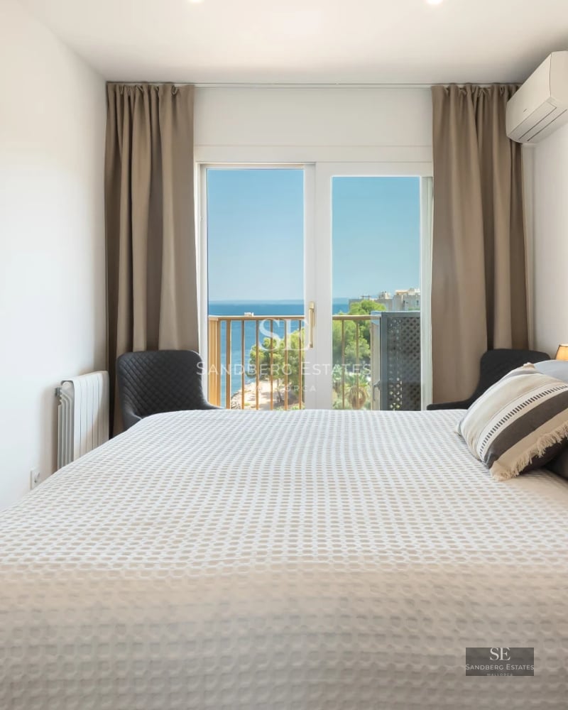 Exterior view of a modern villa featuring a pool and lush gardens. Architectural design with clean lines and large windows.