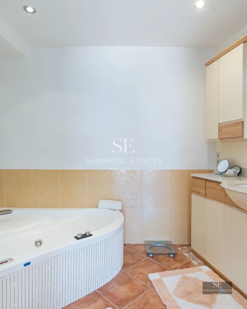 Exterior view of a modern villa with a pool, wooden deck, and large garden. Minimalist architecture with large windows.