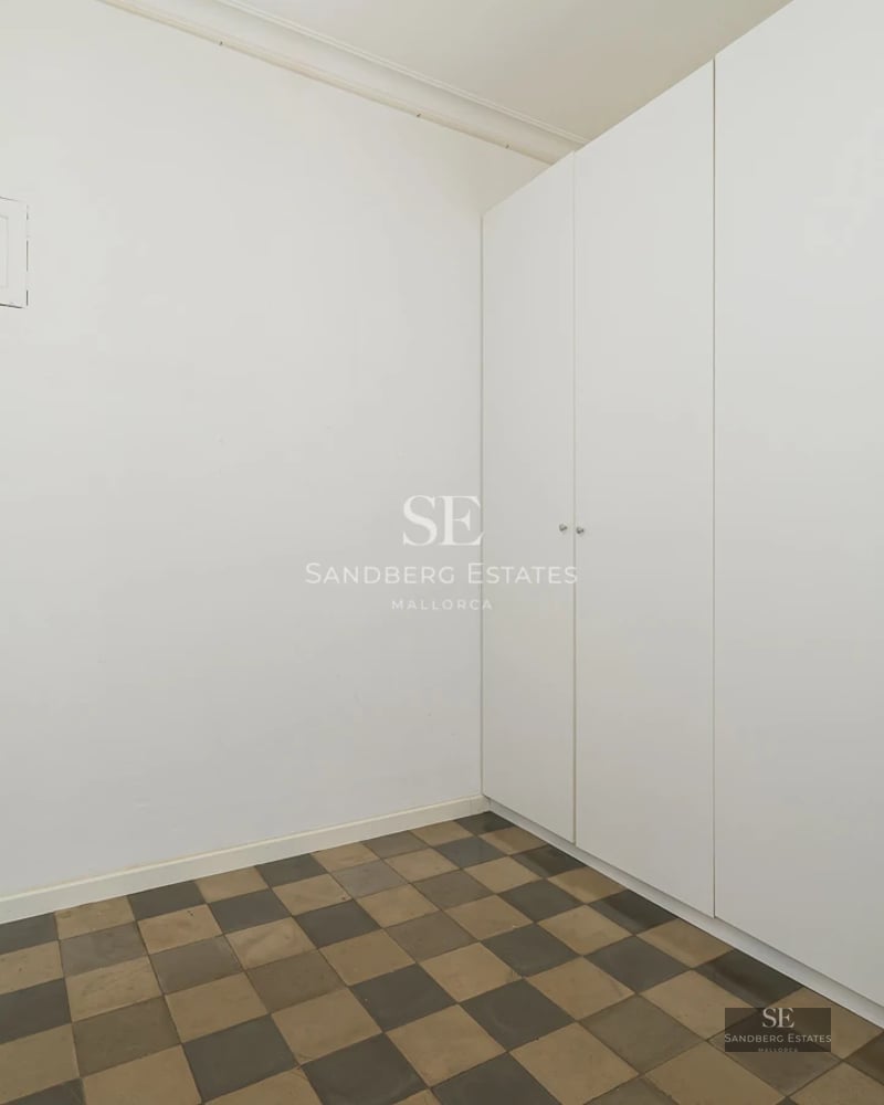 Exterior view of a modern villa with a pool, large windows, manicured garden, and minimalist design. Natural lighting.