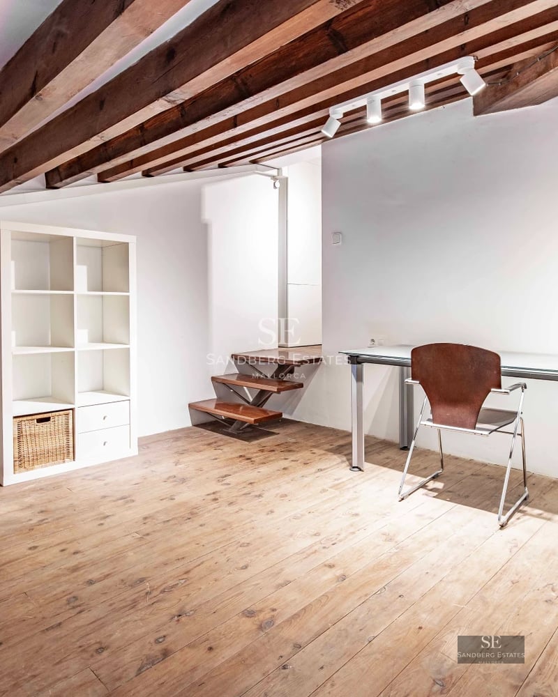 Aerial view of a modern villa featuring an infinity pool, landscaped garden, and expansive terraces. Sleek, minimalist architecture.