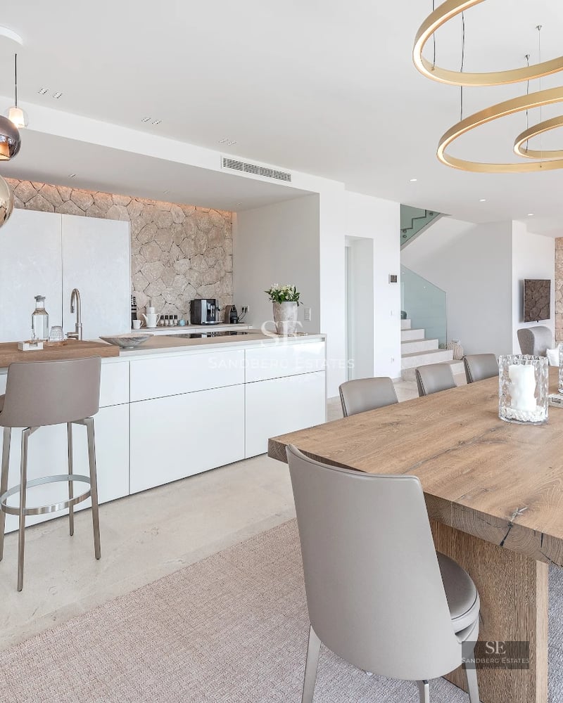 Exterior of modern villa with infinity pool, lush greenery, and minimalist architecture. Open spaces and natural light.