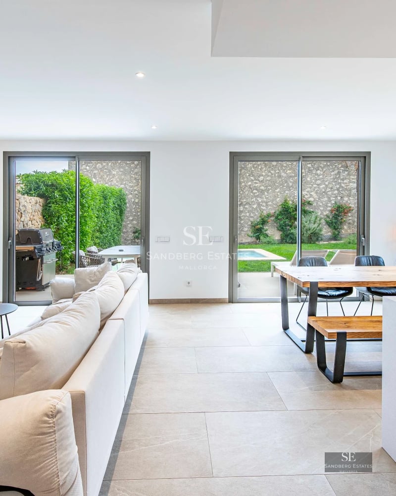 Exterior view of a modern villa featuring a pool, large garden, and minimalist architecture. Sleek and contemporary design.