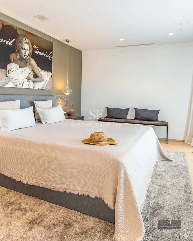 Spacious terrace with infinity pool, sun loungers and breathtaking sea views. Modern architecture with large windows.