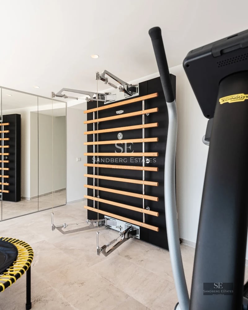 Expansive terrace with pool, sun loungers, and panoramic views. Modern design featuring wood and natural stone elements.