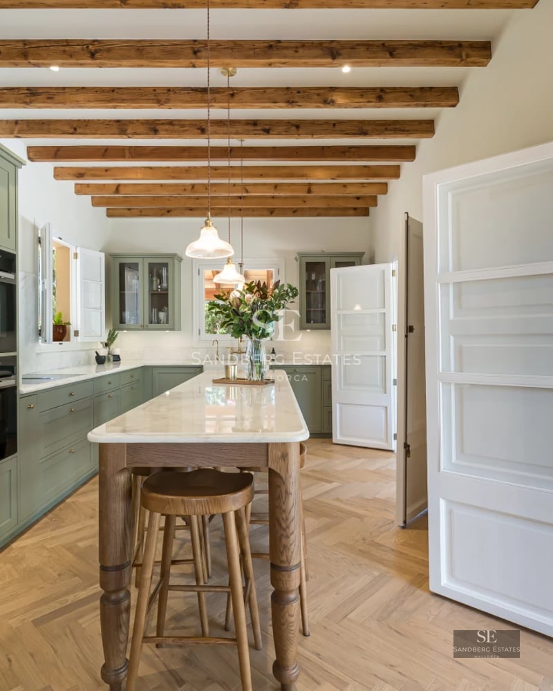 Panoramic view from a balcony with infinity pool and sea views. Modern, minimalist design, with glass railing.