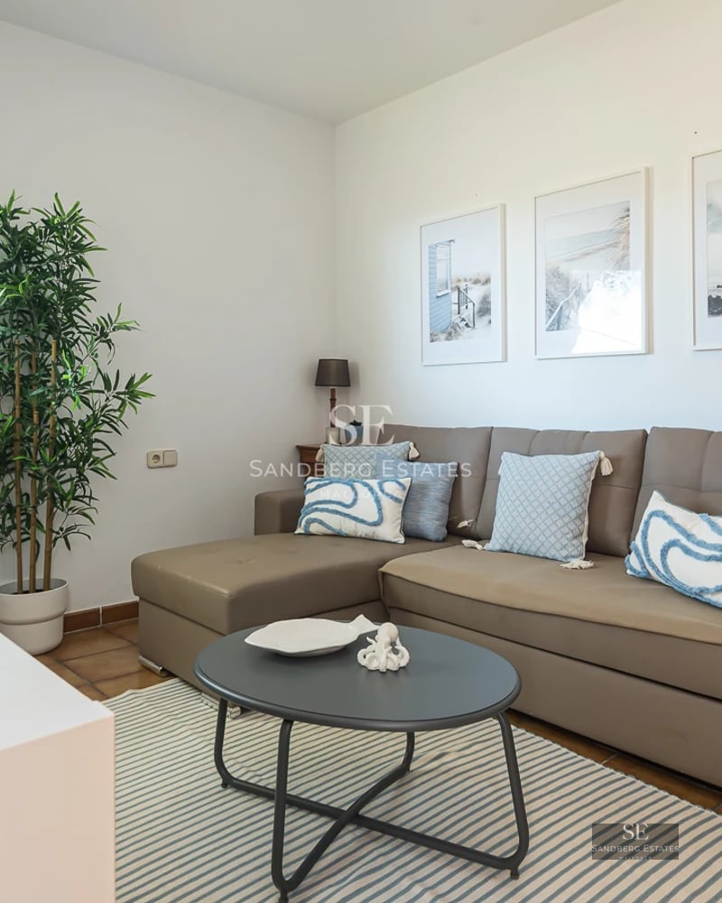 Exterior of a luxurious home with a pool, surrounded by greenery. Modern architecture with large windows and landscaped design.