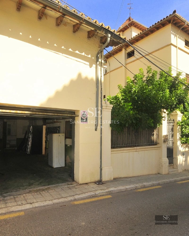 Exterior view of a modern villa with infinity pool, lush garden, and minimalist architecture. Warm ambient lighting.