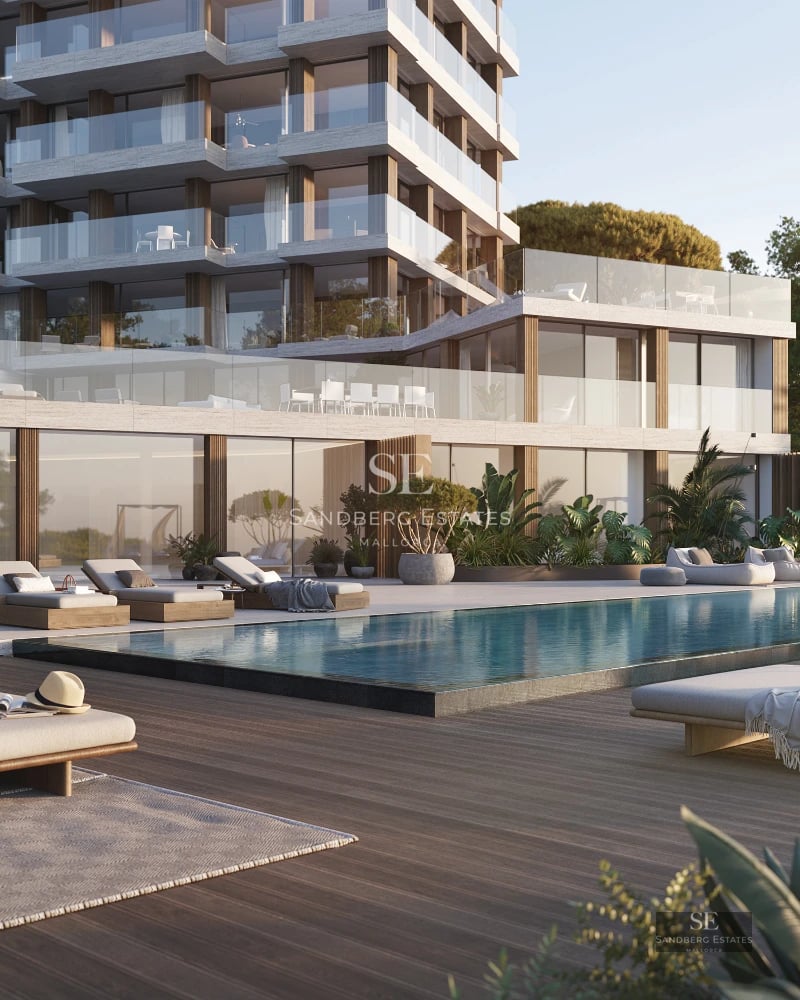 Expansive exterior with glistening pool, modern architecture with clean lines and window walls. Ideal for sunbathing.