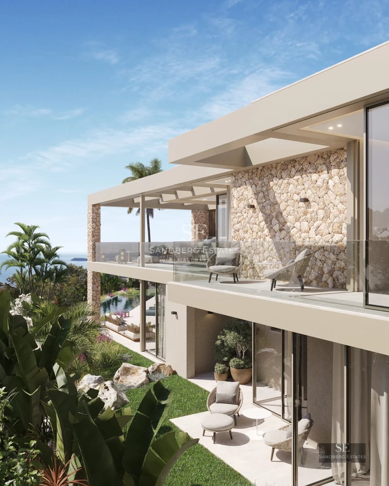 Expansive terrace with infinity pool, elegant sun loungers, and panoramic sea views. Modern design featuring clean lines and luxurious furnishings.