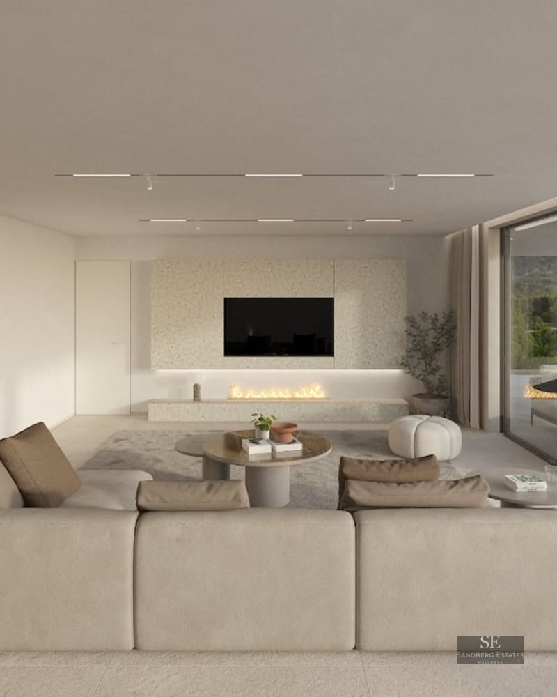 Spacious neutral-toned living room with large sectional sofa, built-in fireplace, and glass doors to terrace.