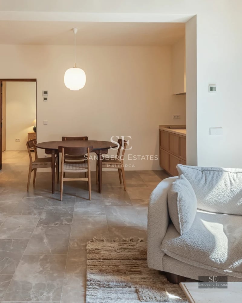 Pool view with lounge chairs and lush garden. Elegant modern design. Natural lighting highlighting the vegetation.