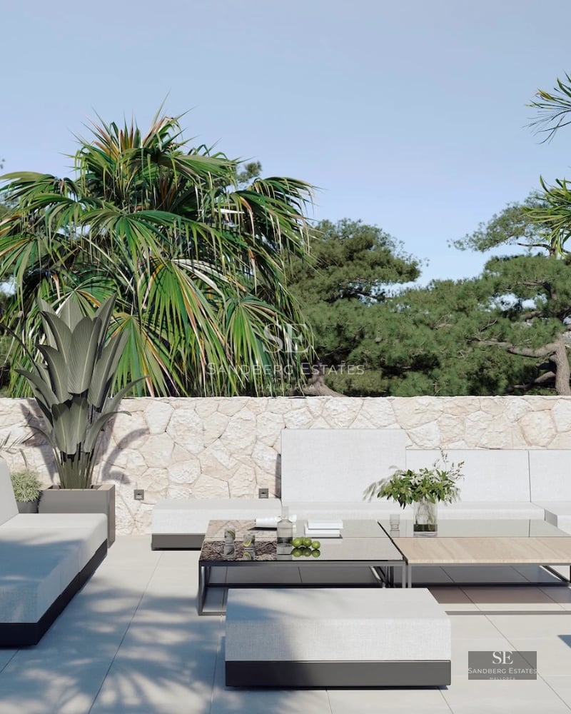 Spacious balcony with sea view. Glass railing, light tile flooring, and modern outdoor furniture. Bright and open space.