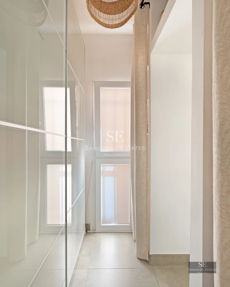 Exterior view of modern villa with pool, manicured garden, and minimalist facade. Luminous architecture with large windows.