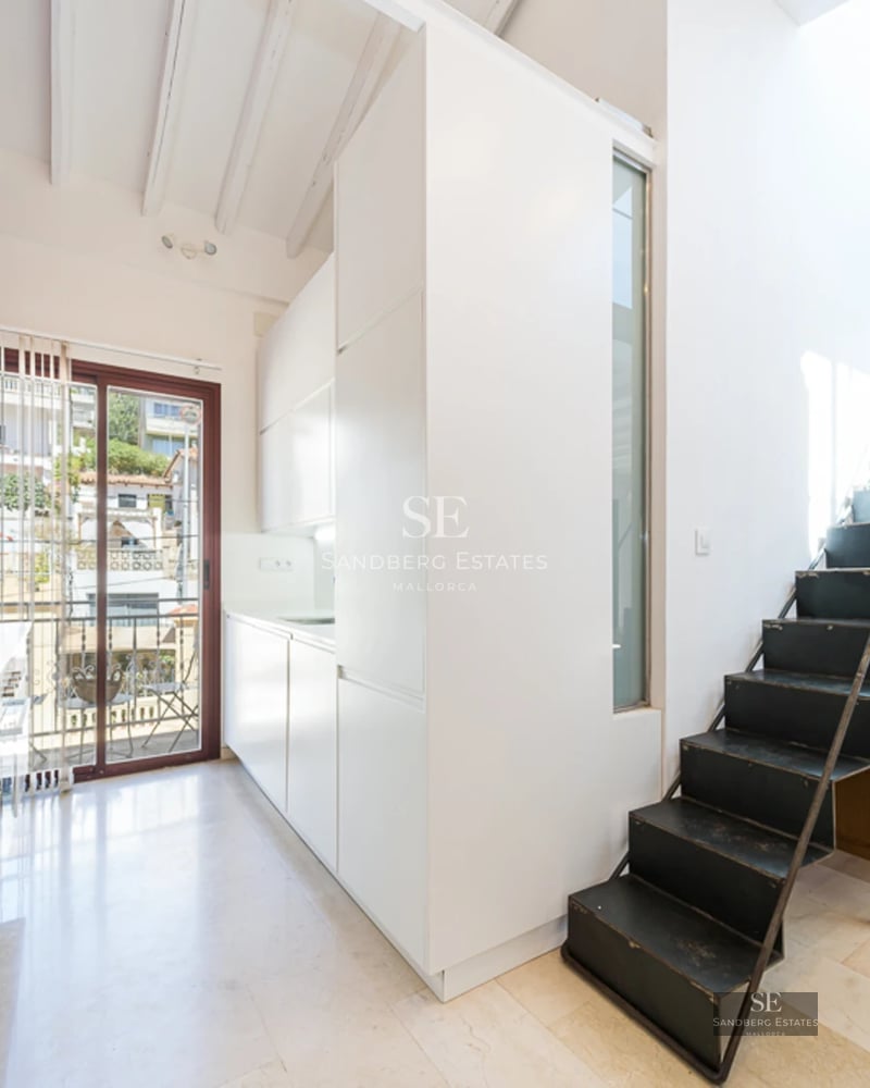 Exterior view of a modern villa with a swimming pool. Sleek design featuring large windows, a garden, and minimalist outdoor furniture.