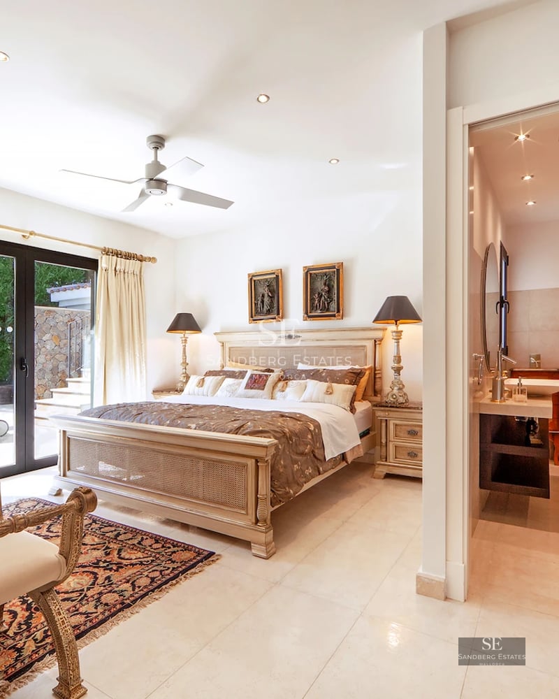 Spacious living room with window walls, terrace with sea view, modern design, light wood floors, minimalist decor.