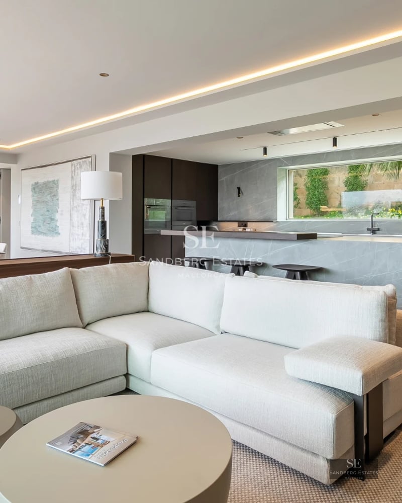 Terrace with infinity pool and panoramic views. Modern design with wooden floors and glass railing. Ambient lighting.