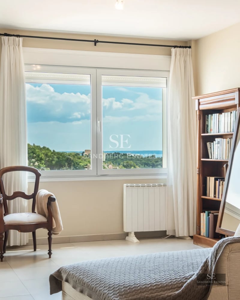 Spacious terrace with pool and unobstructed views. Modern design, elegant sun loungers, and lush vegetation.