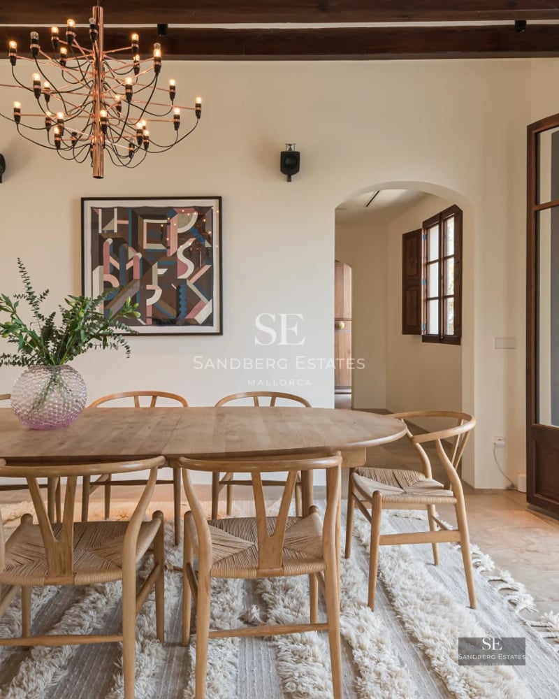 Modern facade with large windows, reflective pool, and lush garden. Minimalist and elegant design with natural light.