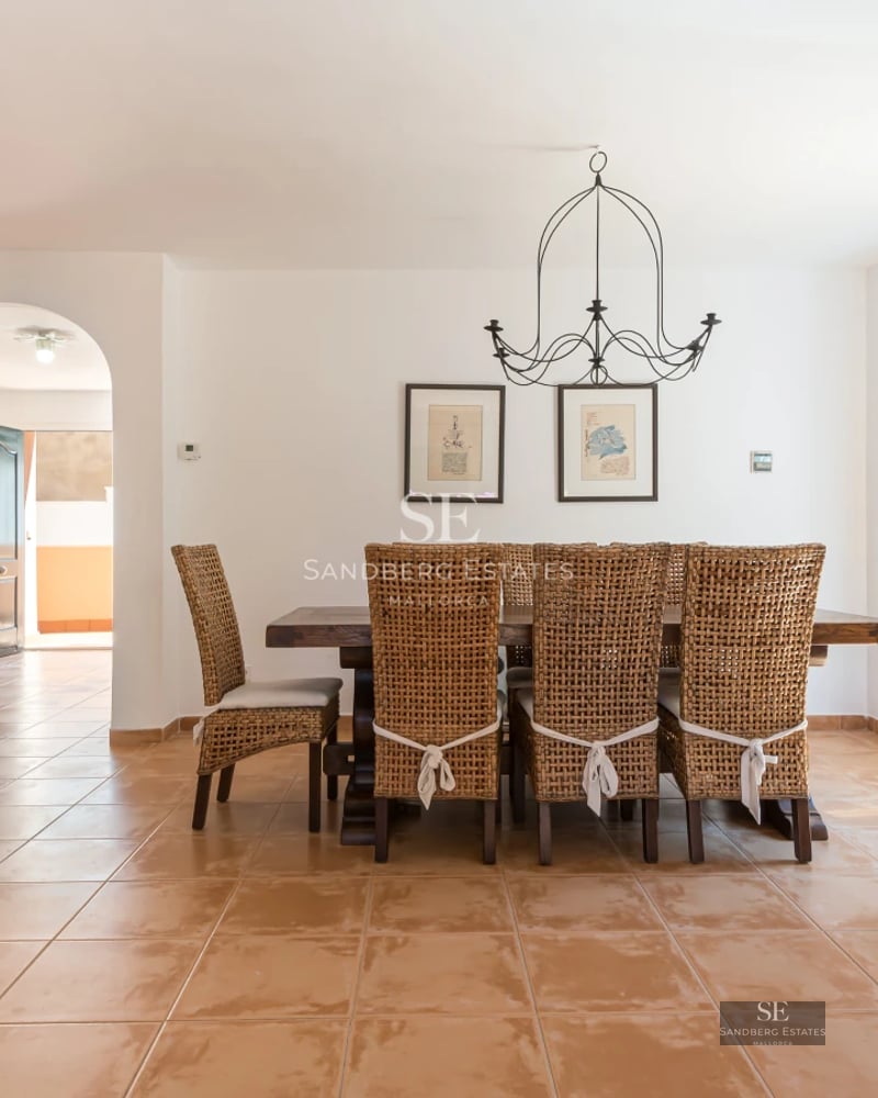 Exterior view of a modern villa with pool and lush garden. Minimalist architecture, clean lines, and large windows.