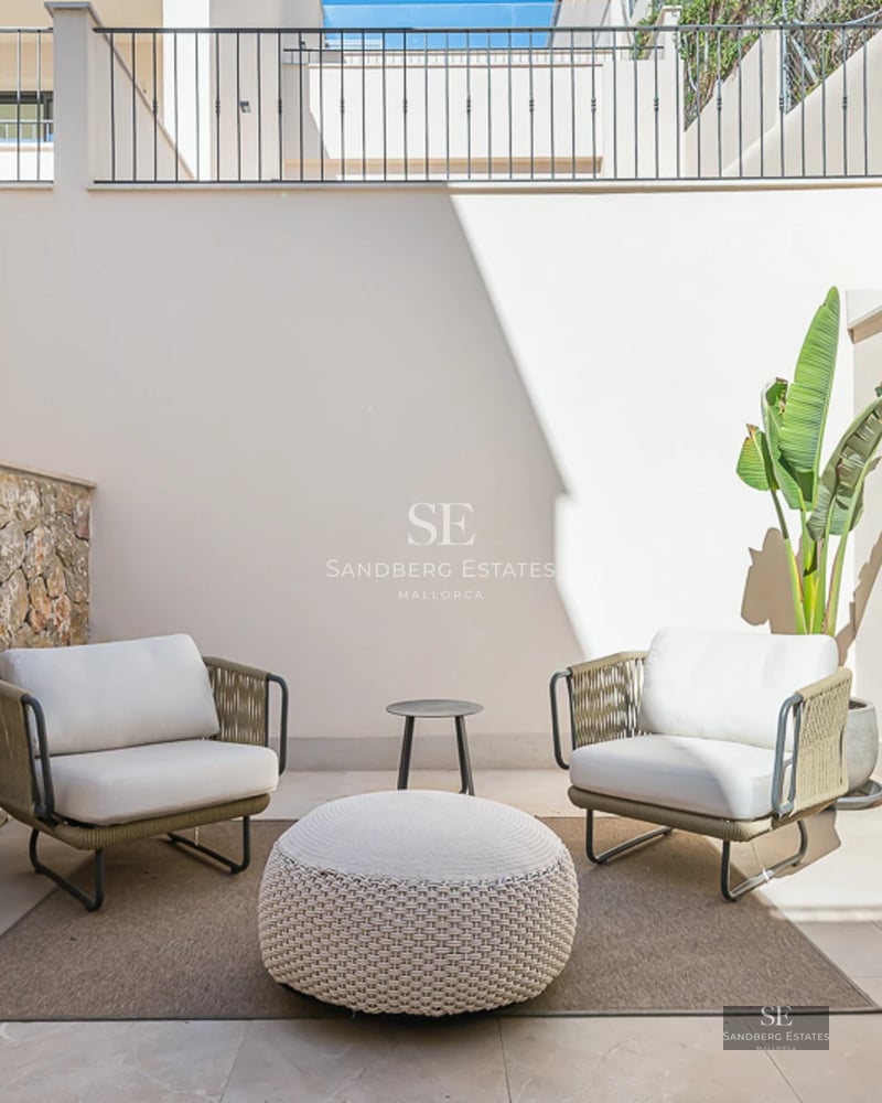 Expansive terrace with infinity pool, sun loungers, and panoramic sea views. Modern design with clean lines and high-quality materials.