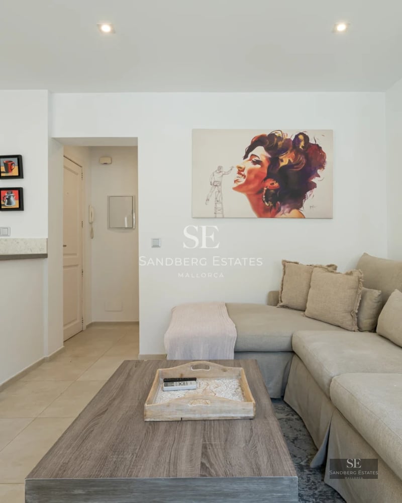 Spacious terrace featuring a pool, sun loungers, and panoramic views. Modern design with glass railing and stylish outdoor furniture.