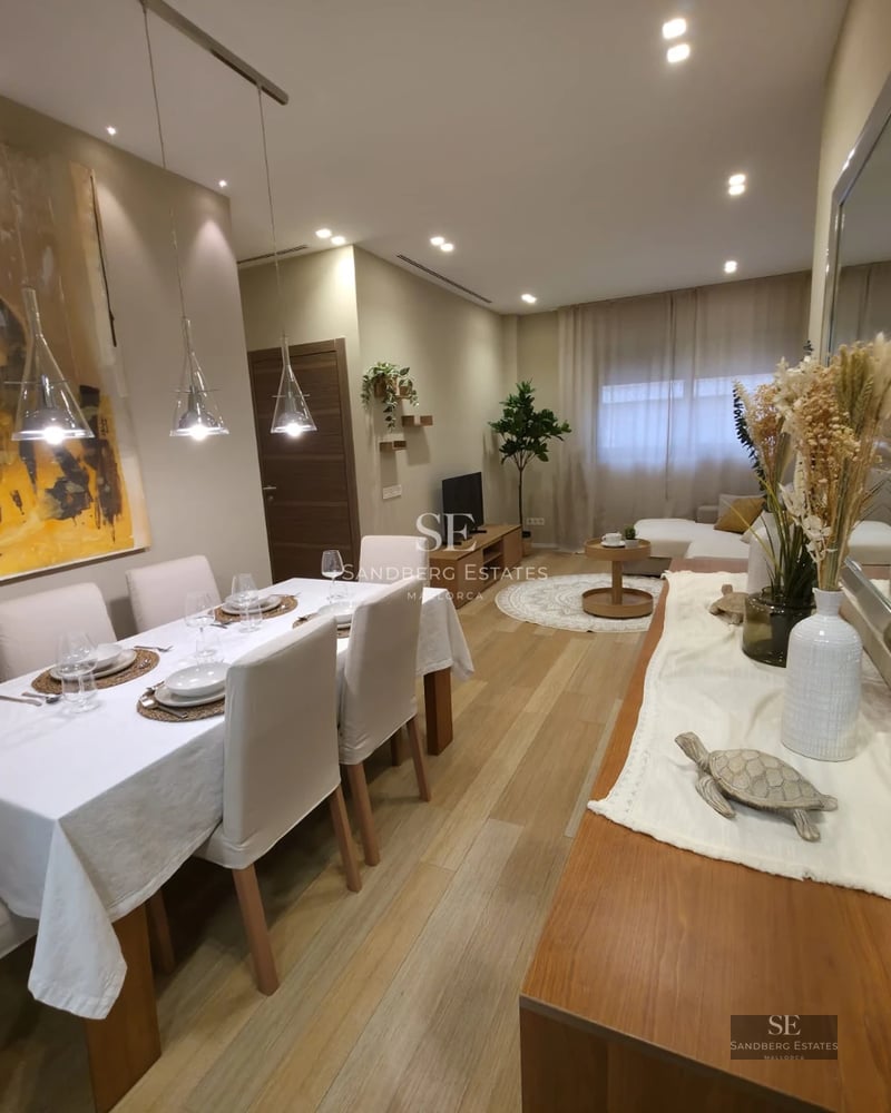 View of a modern villa with infinity pool, lush gardens, and spacious terraces. Minimalist design and abundant natural light.