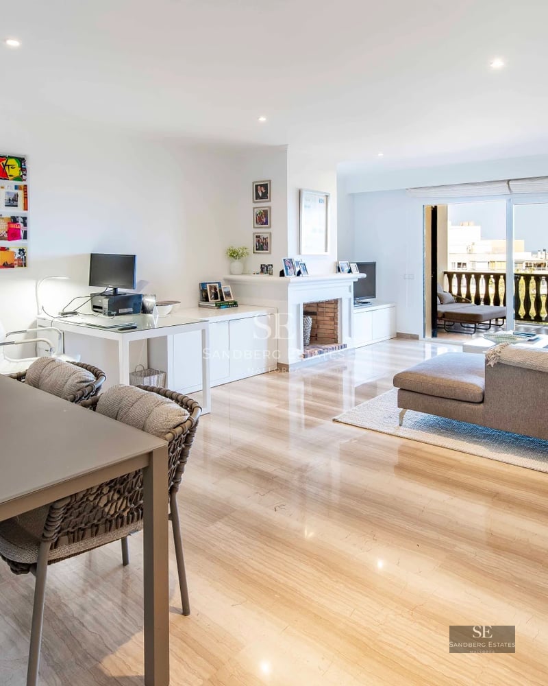 Spacious terrace with pool, sun loungers and panoramic views. Modern design with wooden floors and elegant furniture.