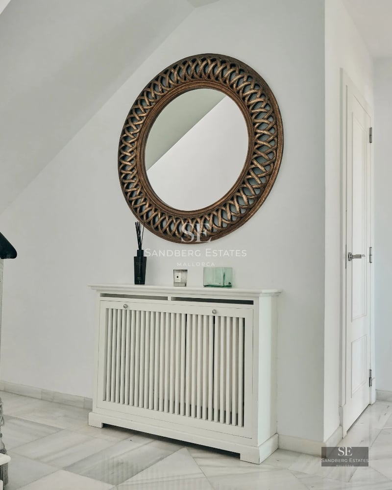 Spacious living room with floor-to-ceiling windows, infinity pool, and ocean view. Modern design, high-end finishes, and abundant natural light.
