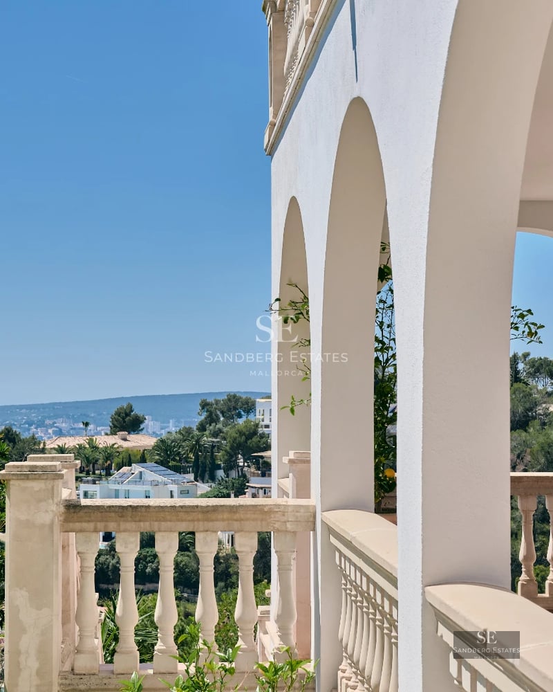 Exterior view of a modern villa featuring an infinity pool, garden, and large terraces. Minimalist design with expansive windows.