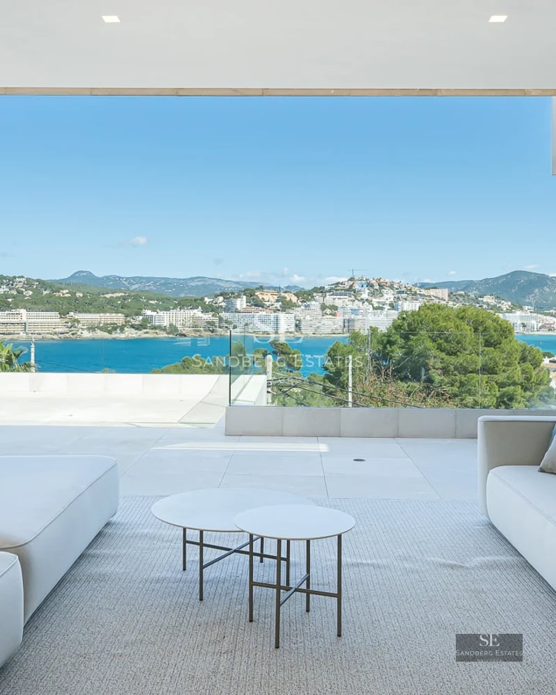 Exterior view of a modern villa featuring a pool, lush garden, and minimalist architecture. Natural lighting and high-quality finishes.