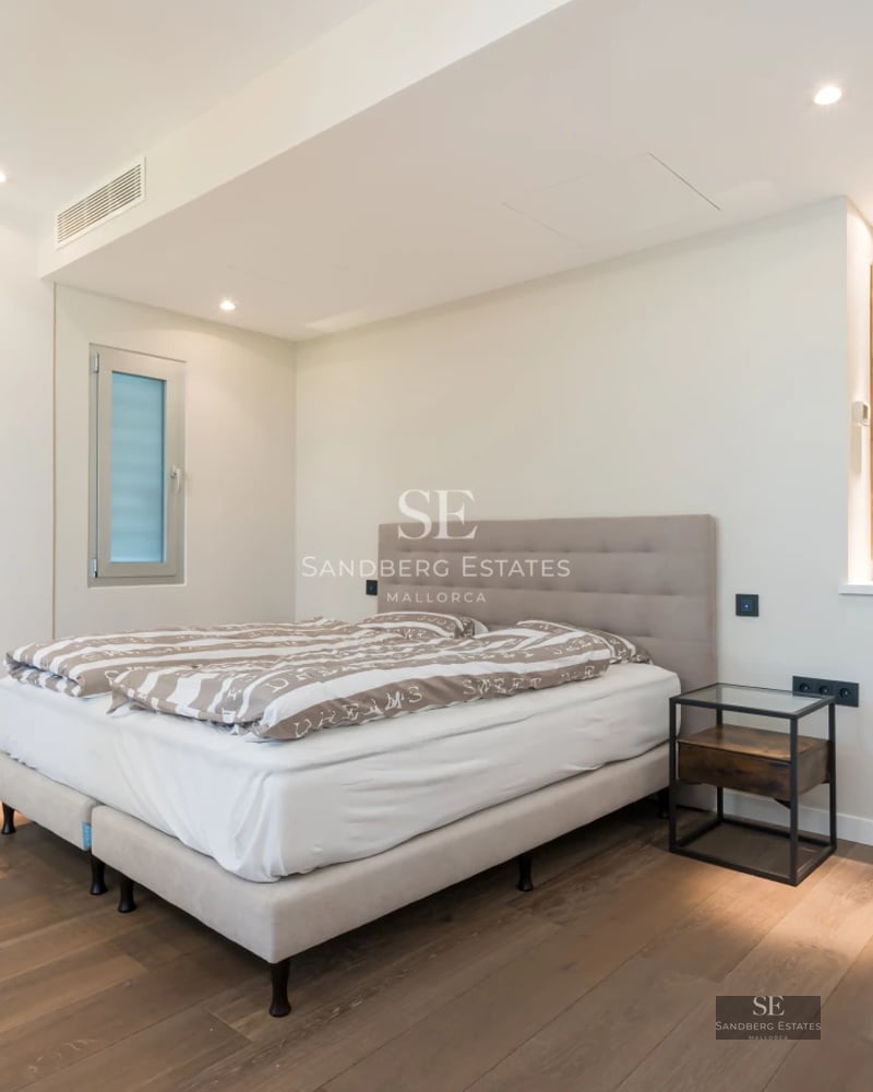 Spacious terrace with pool and sea view. Modern design, elegant furniture, and neutral color palette. Abundant natural lighting.