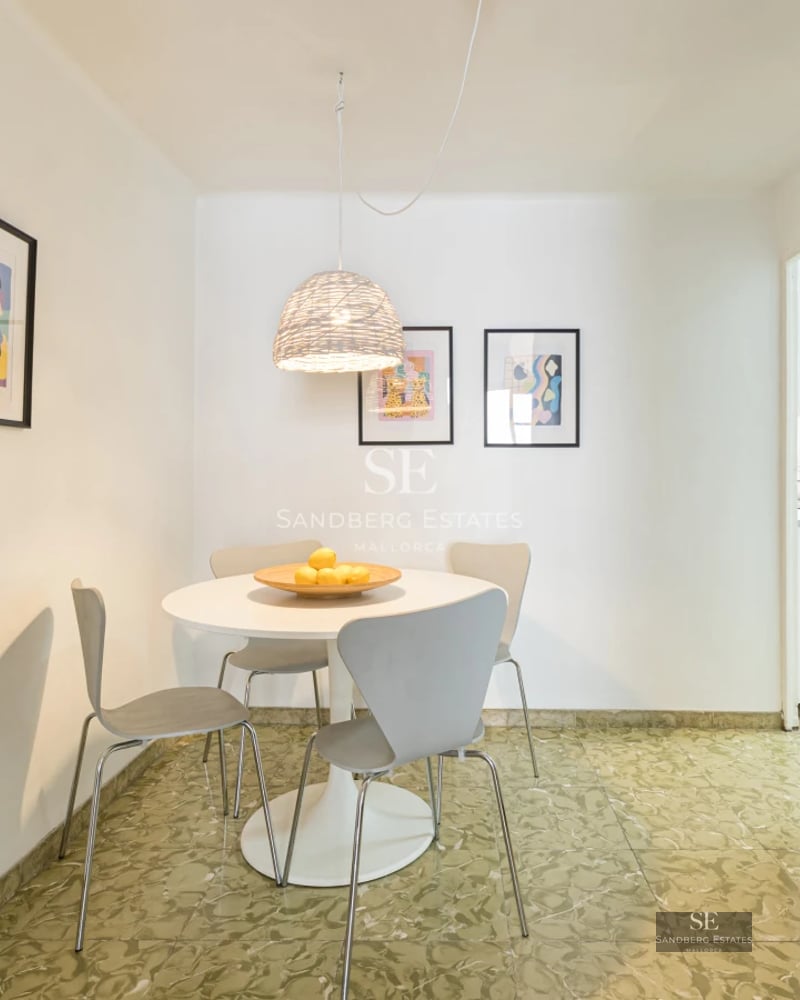 Exterior of modern villa featuring an infinity pool and ocean view. Clean architecture, large windows, and lush garden.