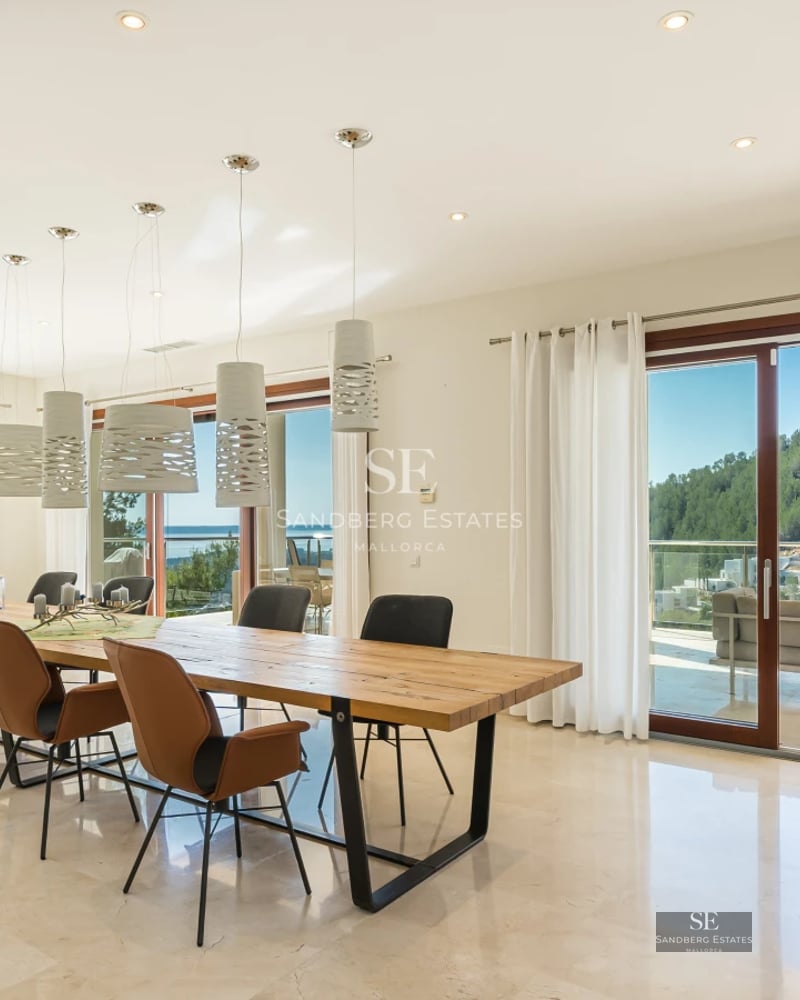 Exterior view of a modern villa with infinity pool. Minimalist design, large windows, spacious terrace and manicured garden.